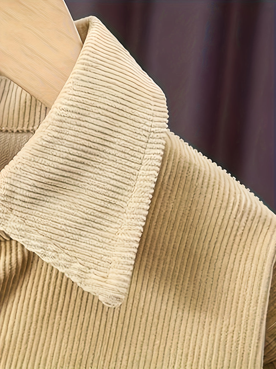 Close-up of beige corduroy fabric with a blurred background