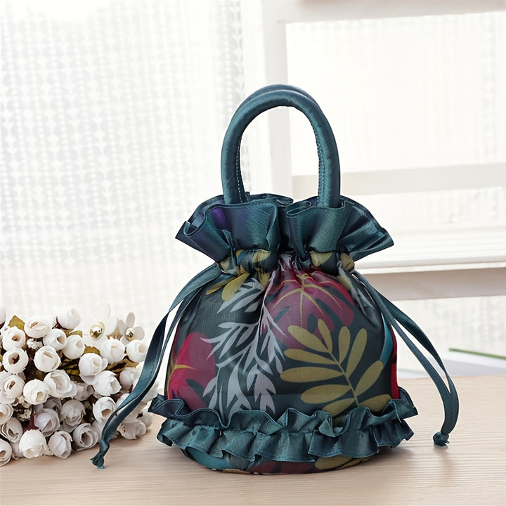 Decorative bag with floral pattern and ruffled details on a light surface.