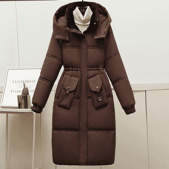 Brown Women's Plus Size Long Hooded Puffer Coat Styled Over A Cream Turtleneck
