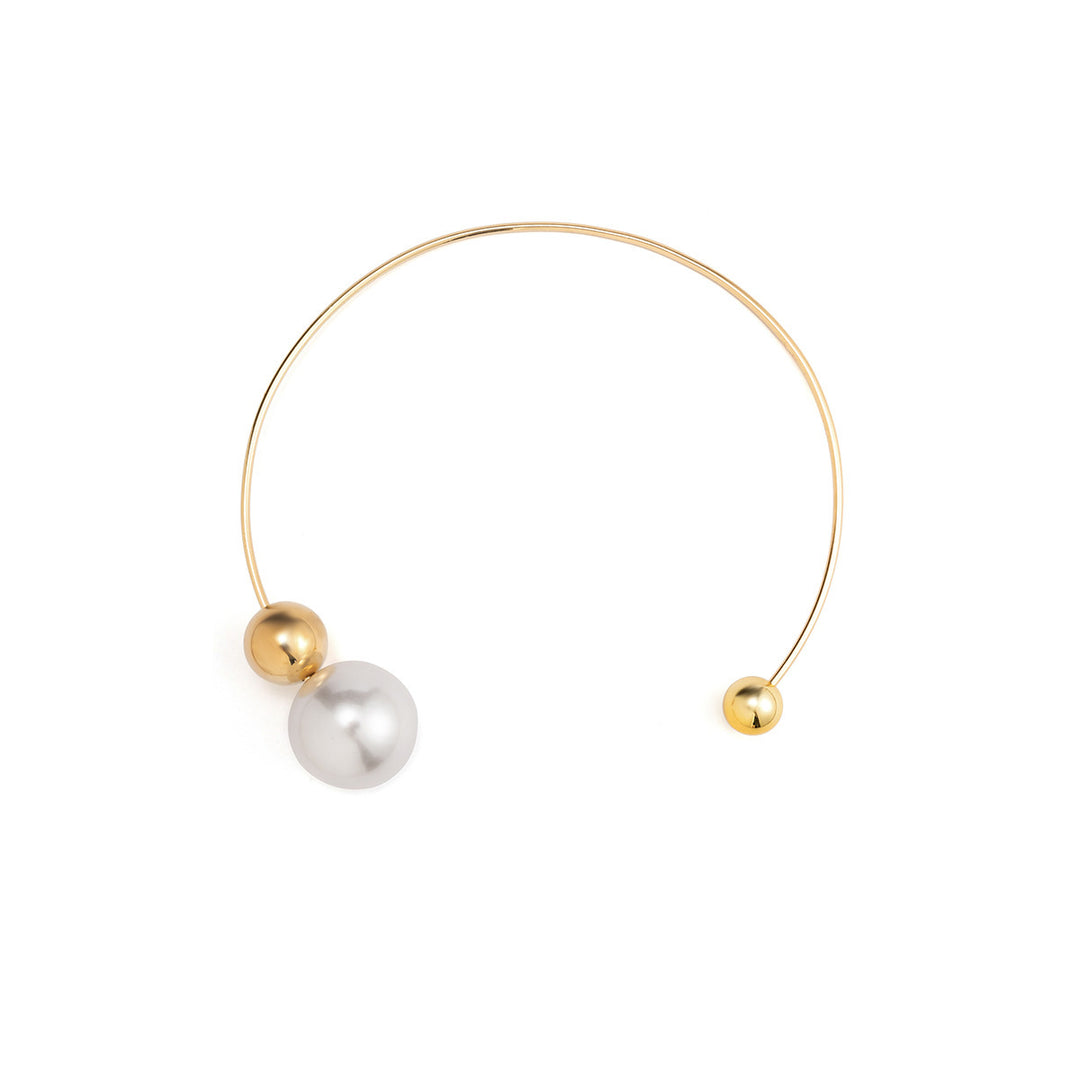 Gold and pearl necklace on a white background