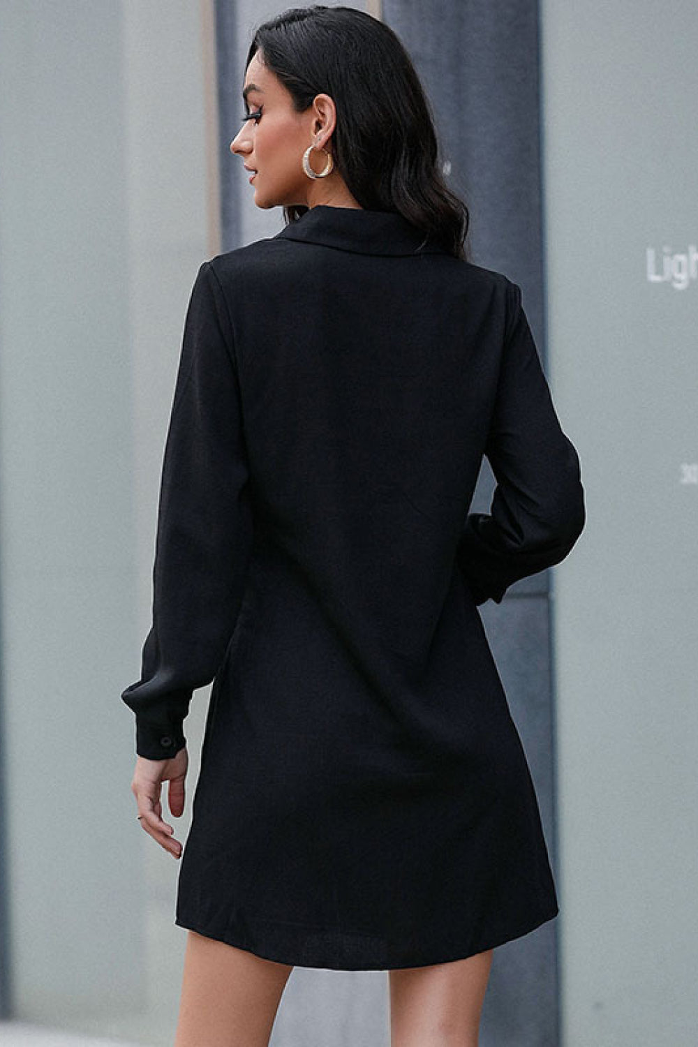 Black belted mini shirt dress back view with long sleeves and button placket