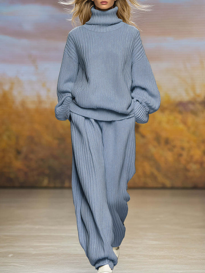 Gray-blue ribbed knit two-piece set with high-neck top and wide-leg pants, long sleeves