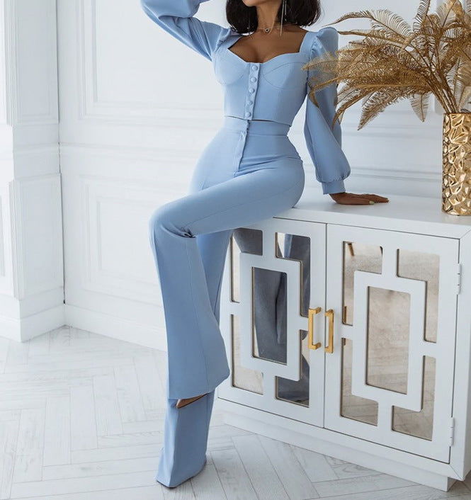 Sky blue crop top with button front and bishop sleeves, paired with flared high-waist pants