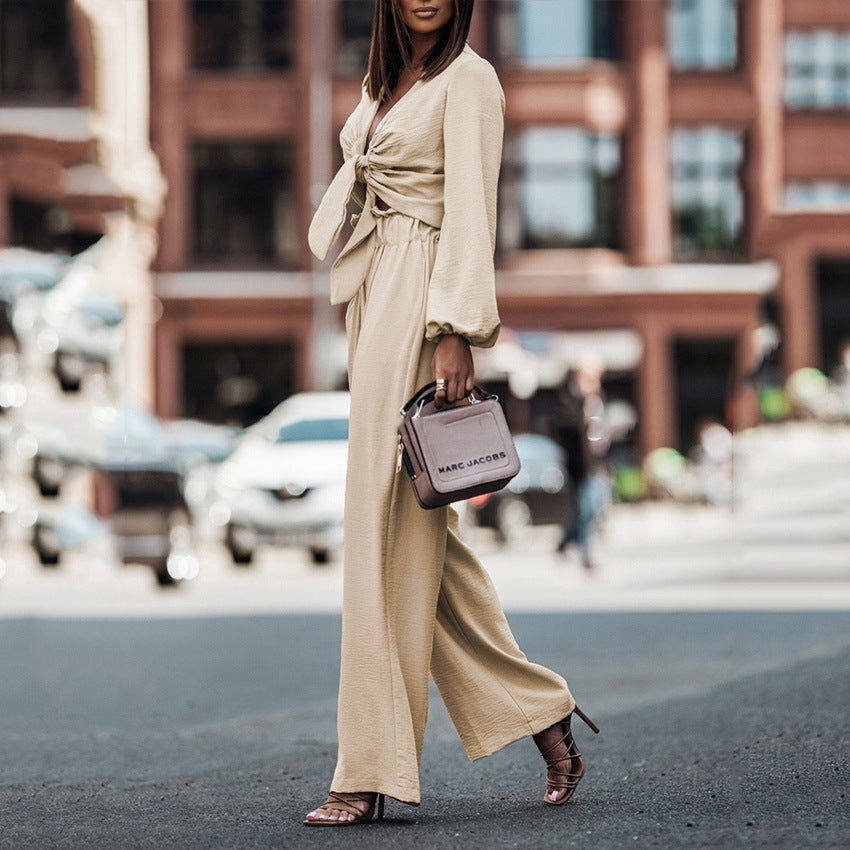 Beige long-sleeve tie-front top with high-waist wide-leg pants