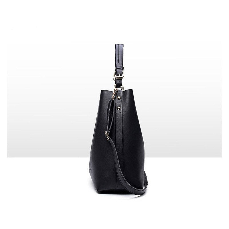 Black leather-look shoulder bag with short handle, long crossbody strap, metal hardware