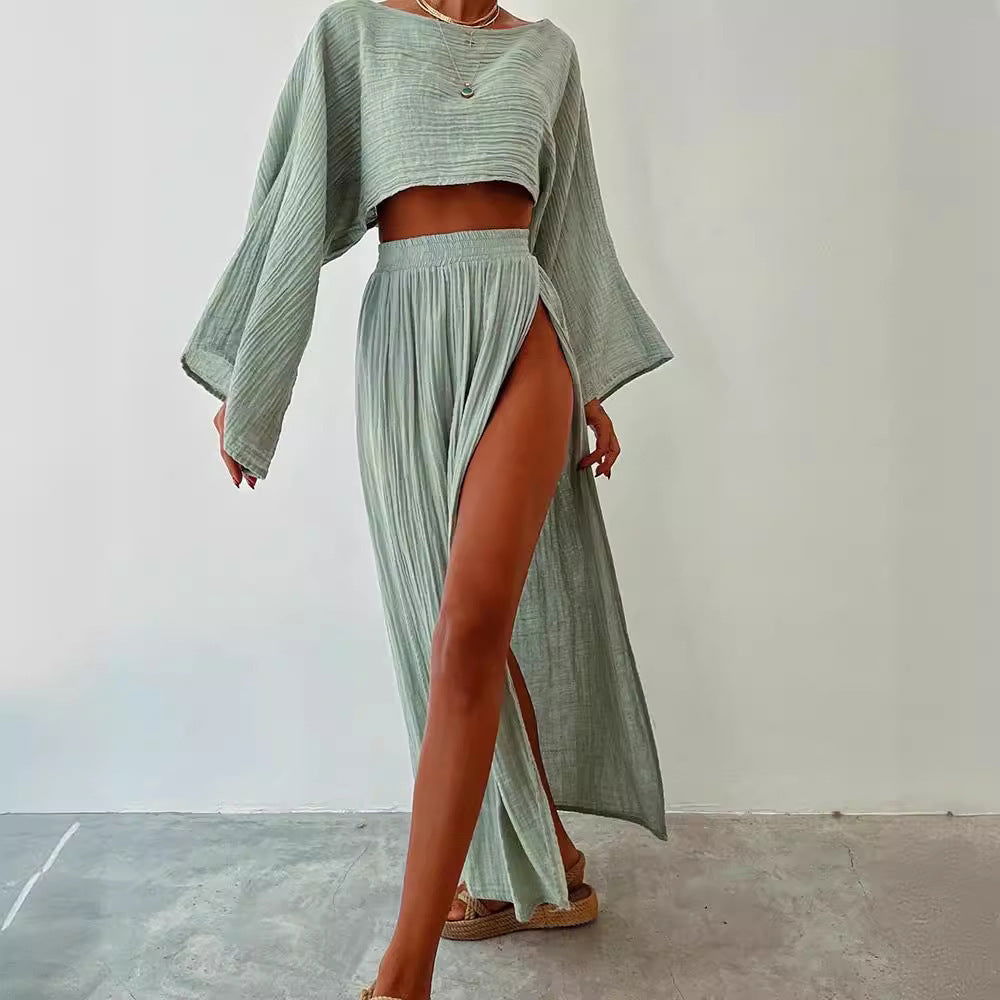 Light green cropped top with long sleeves and high-slit maxi skirt, side slit