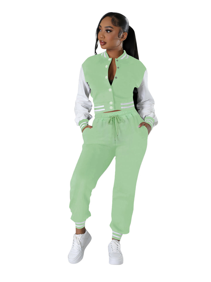 Light green and white varsity jacket with drawstring joggers, ribbed stripe cuffs.