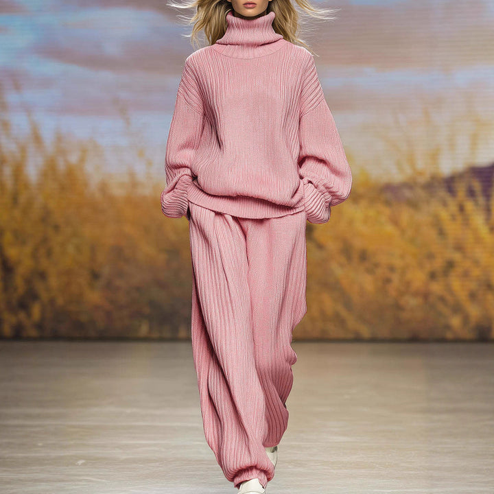 Pink ribbed knit two-piece set with high-neck top and wide-leg pants, long sleeves