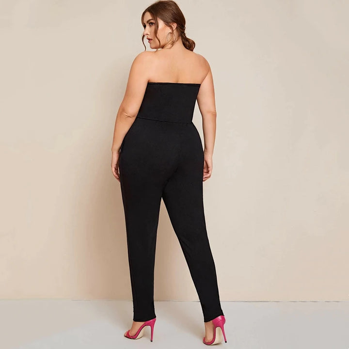 Solid black strapless tube jumpsuit with straight bandeau neckline and tapered full legs