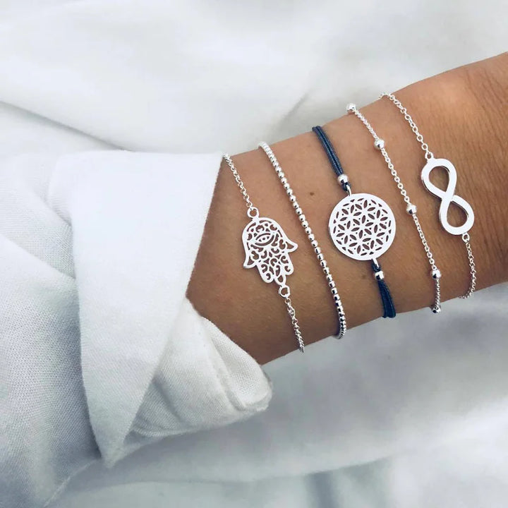 Silver-tone charm bracelets with floral medallion and ribbon bow pendants