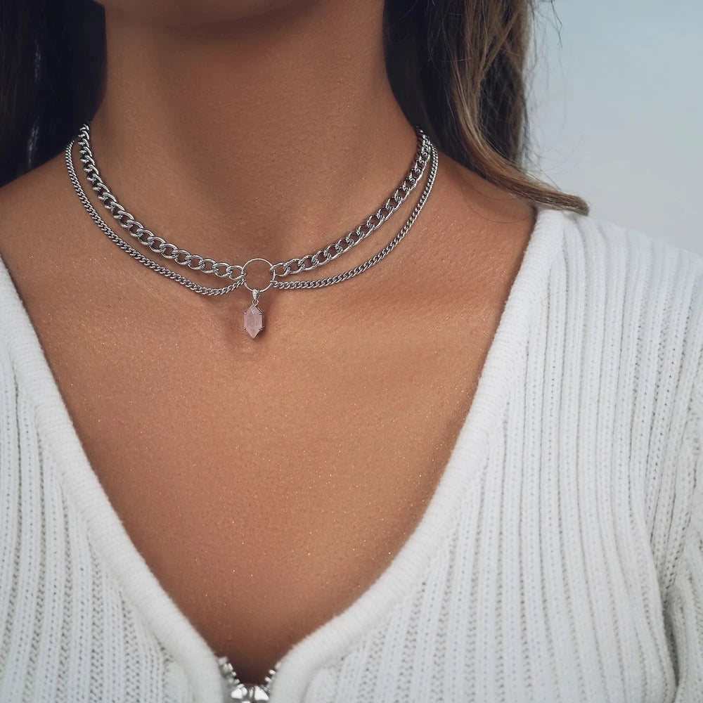 Silver-tone women's necklace with chain links and small purple teardrop crystal pendant.