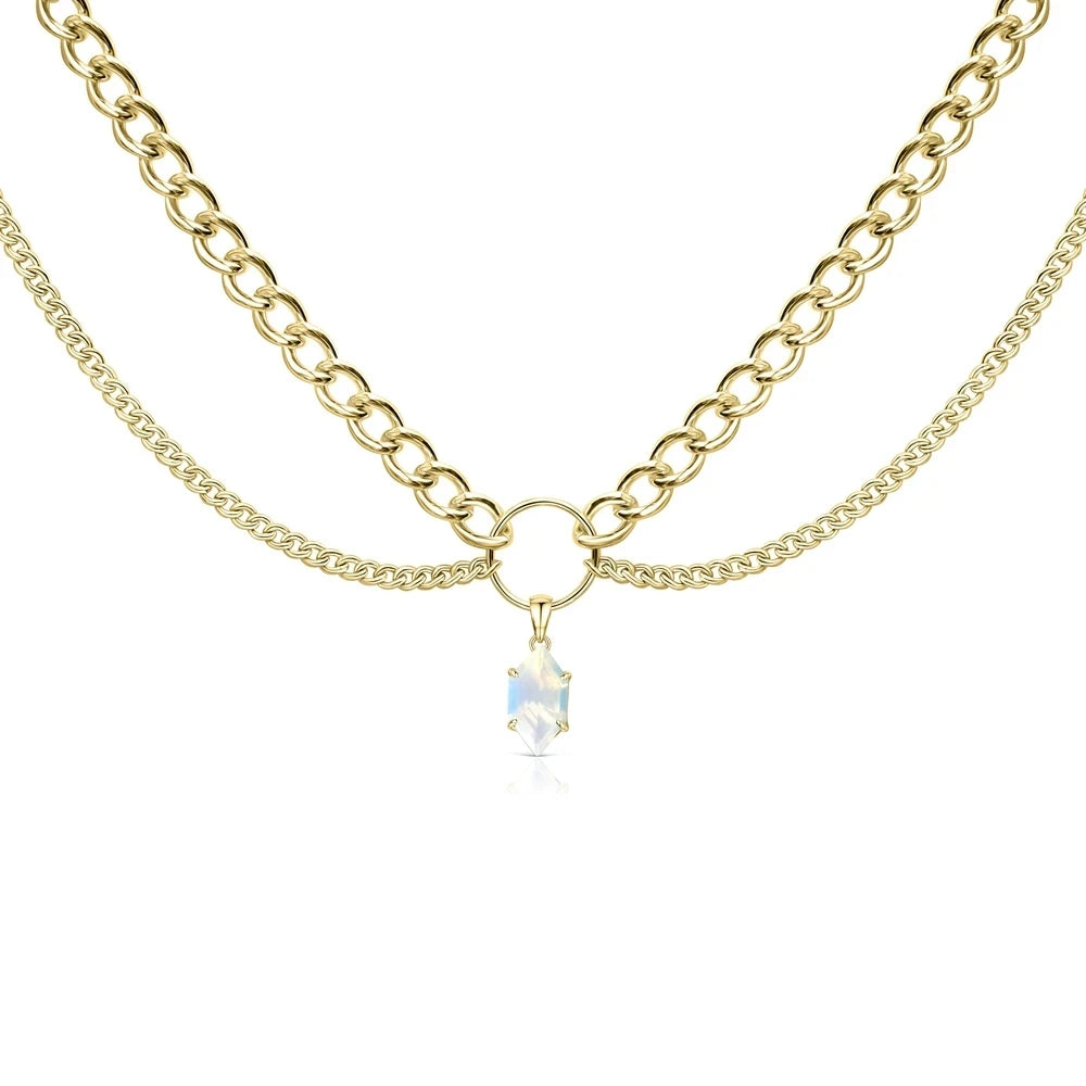 Layered gold-tone chain necklace with clear faceted teardrop pendant
