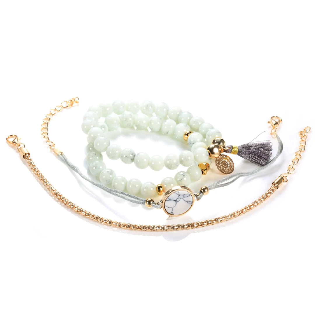 Beaded heart charm tassel bangle bracelet set with white beads and gold-tone accents