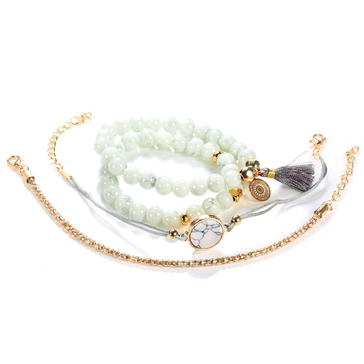 Beaded heart charm tassel bangle bracelet set with white beads and gold-tone accents