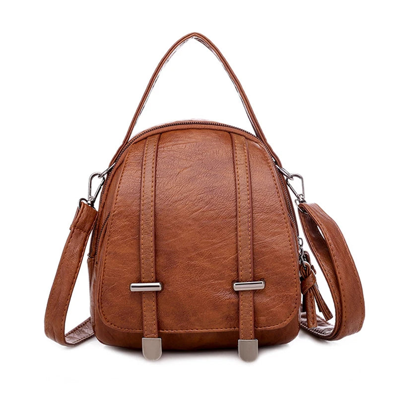 Brown leather backpack with a strap on a white background