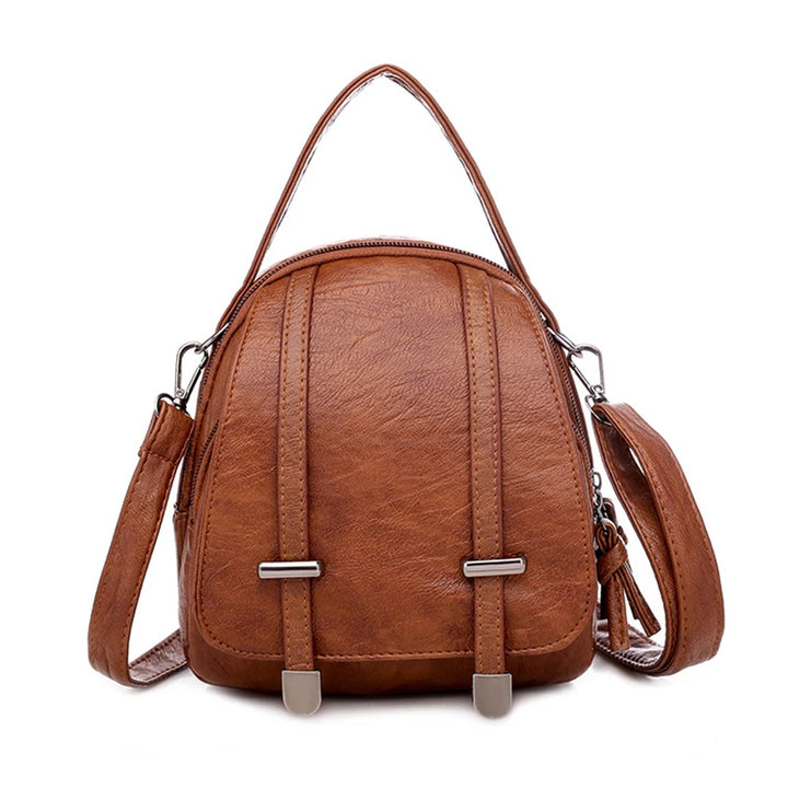 Brown leather backpack with a strap on a white background