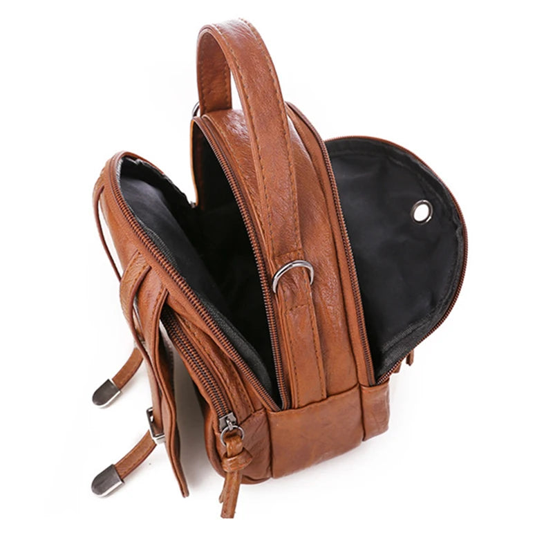 Brown leather backpack with open front pocket on a white background
