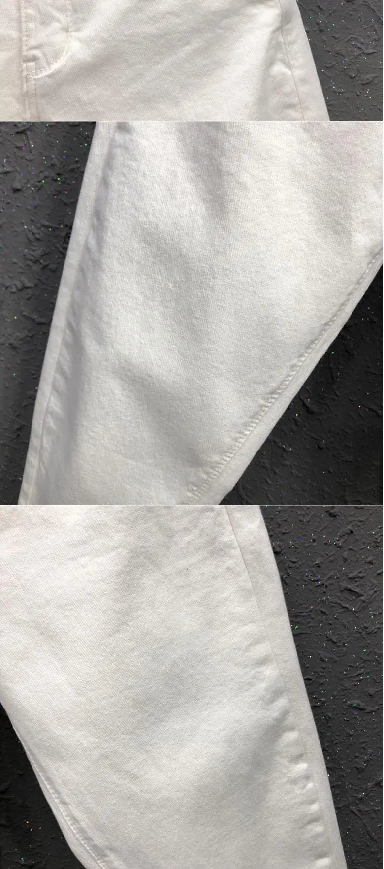 White denim fabric close-up on high-waist wide-leg jeans with visible stitching