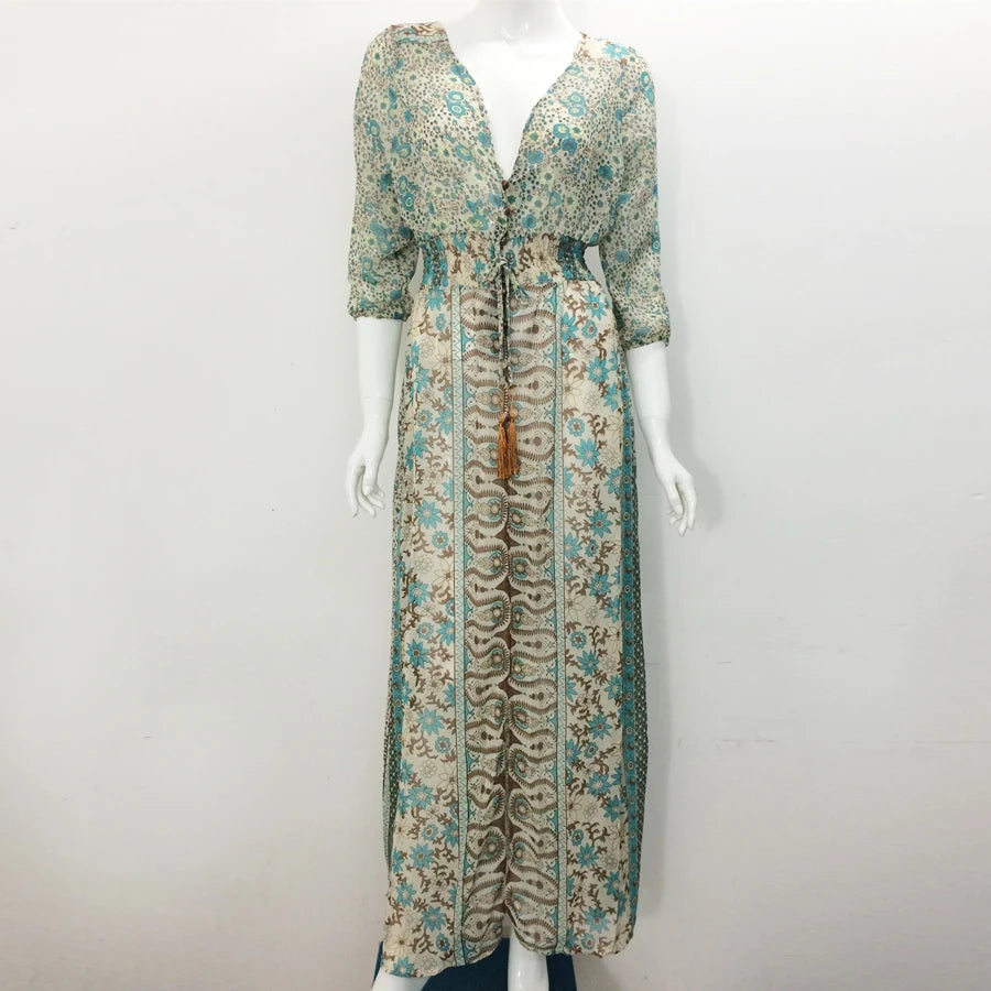 Floral patterned dress on a mannequin against a white background