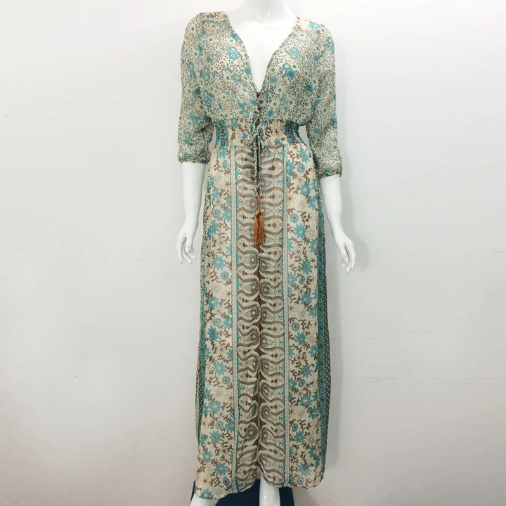 Floral patterned dress on a mannequin against a white background