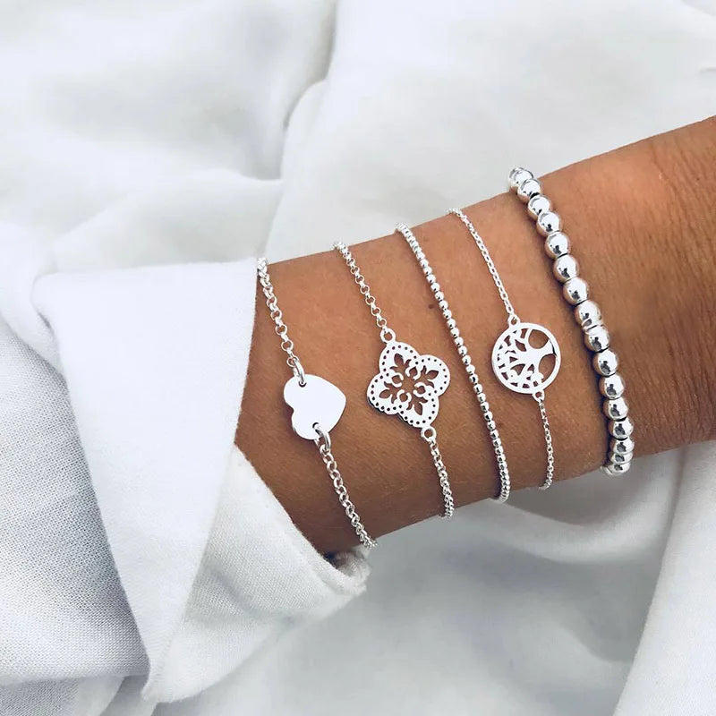Silver-tone charm bracelet set with butterfly and floral round cutout pendants