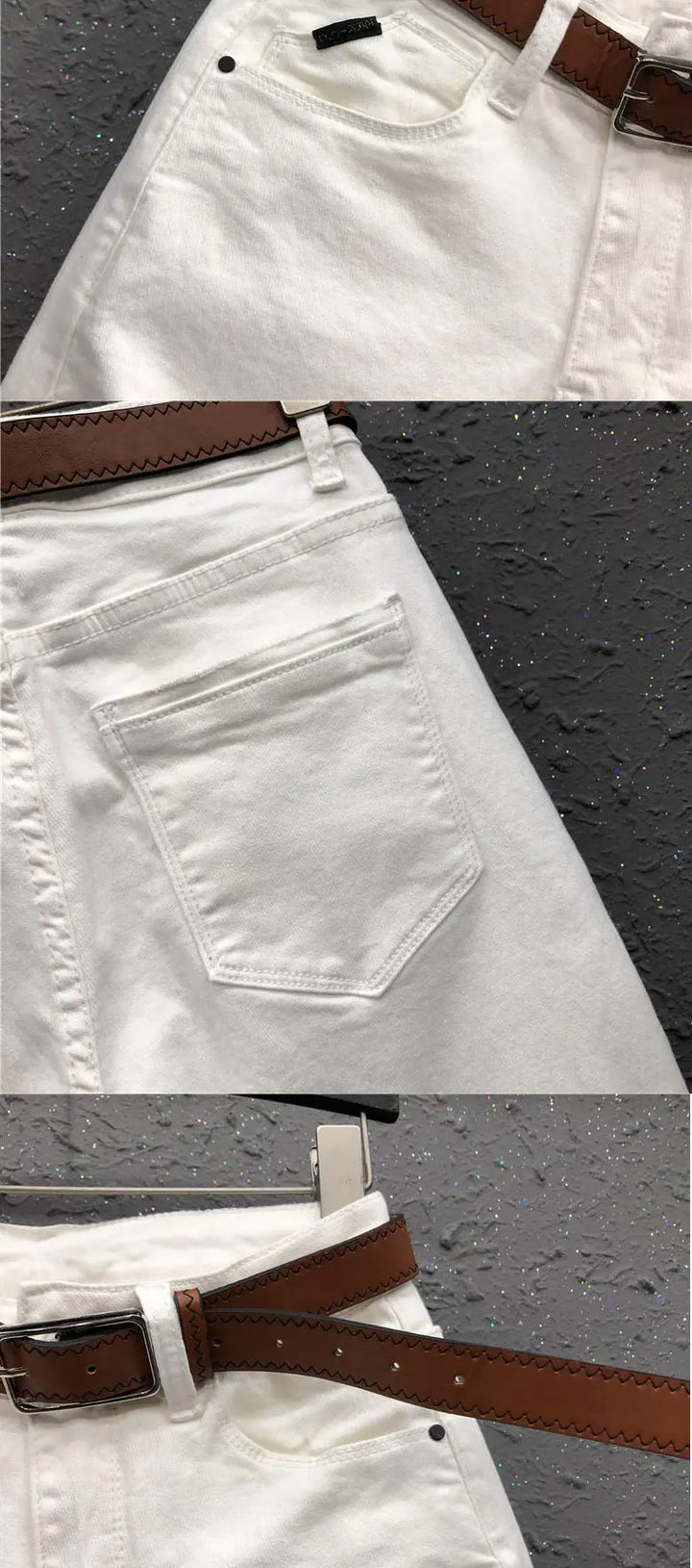 White high-waist jeans close-up, with belt, waistband button, and front pocket