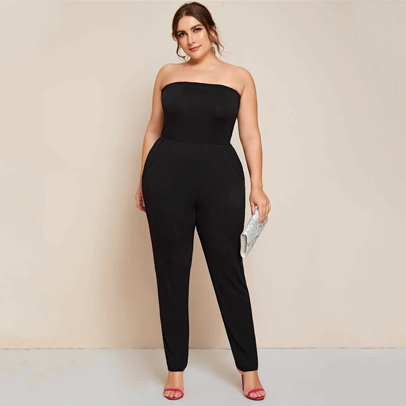 Solid black strapless tube jumpsuit with wide band waist and tapered ankle legs