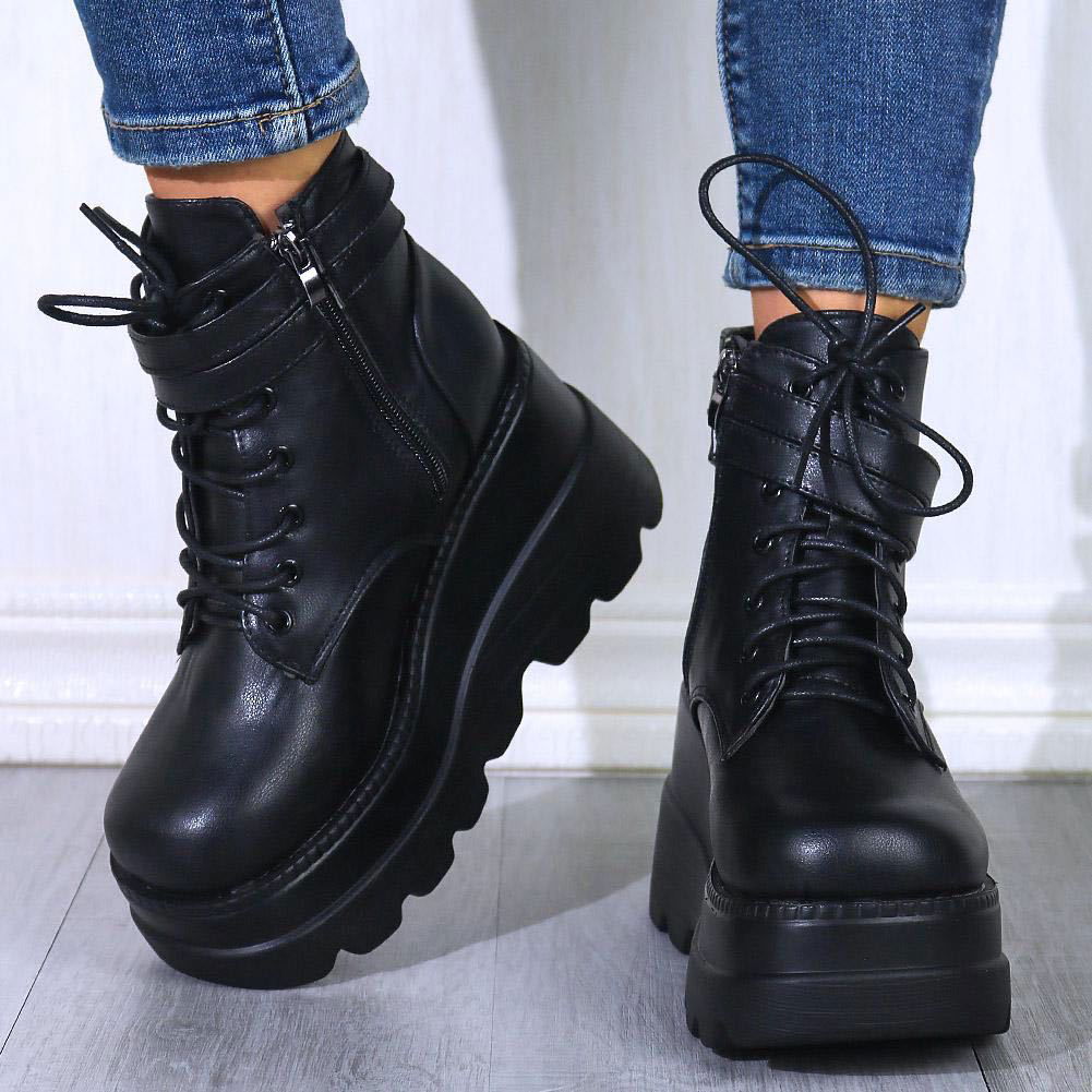 Black platform lace-up ankle boots with chunky tread and zip side detail