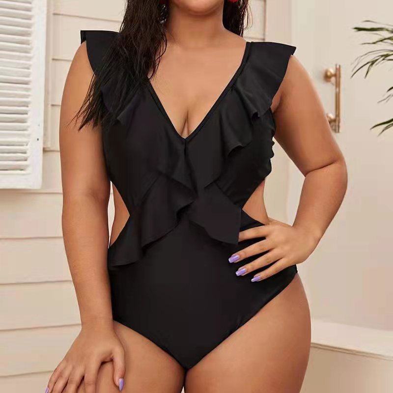 Black cut-out one-piece swimsuit with layered ruffle bodice and deep V neckline