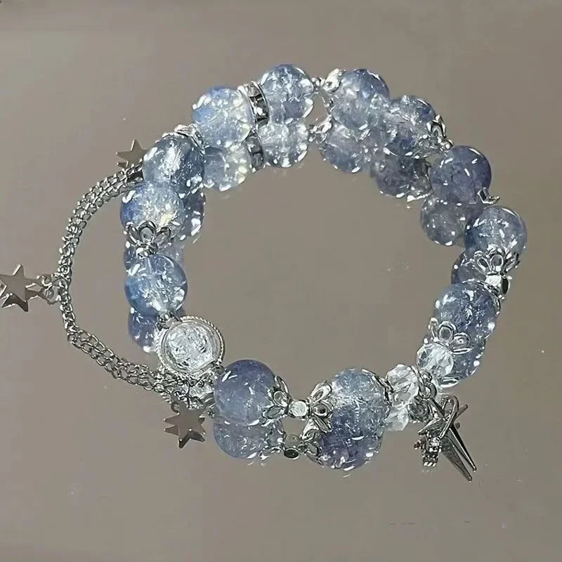 Blue crystal bead elastic bracelet with star charms and dangling tassel charms