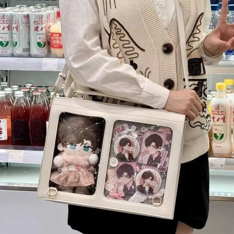 White crossbody bag with two transparent compartments and adjustable shoulder strap