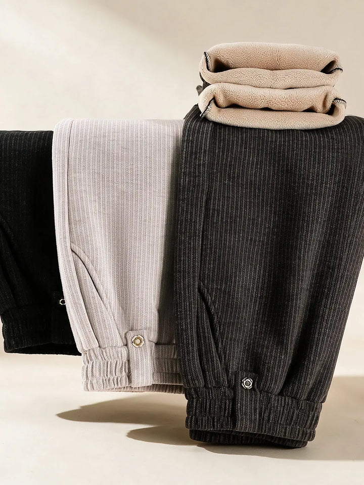 Women's Textured Pants In Black, Light Khaki, And Coffee Brown With Elastic Waistbands.