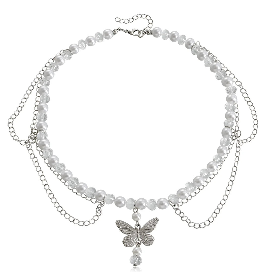 Ivory pearl multi-strand necklace with butterfly charm and teardrop drop, silver-tone chain