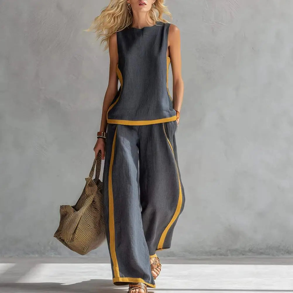 Dark gray sleeveless vest and wide-leg pants set with gold trim