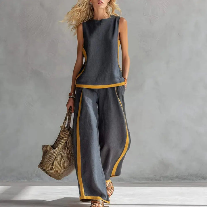 Dark gray sleeveless vest and wide-leg pants set with gold trim