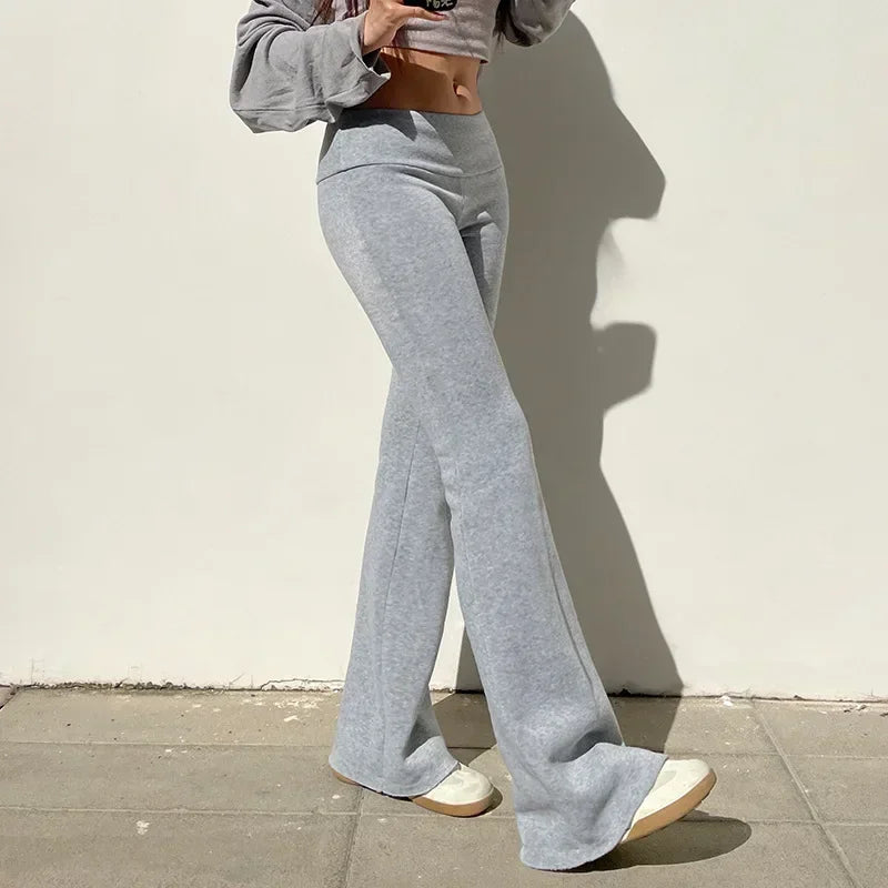 Gray bootcut dress pants with hidden elastic waist and wide, flared bottom