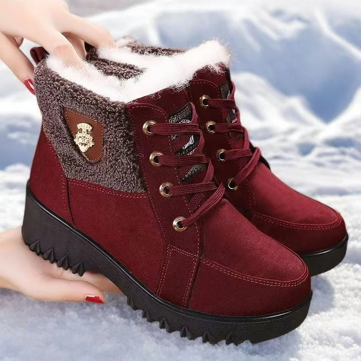 Women’s burgundy lace-up winter boots with gray side panel, faux-fur cuff, traction sole