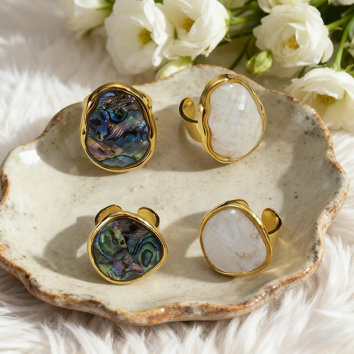 Gold open ring pair: oval abalone shell inlay, iridescent blue-green and opal-like white