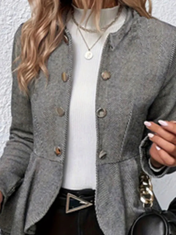 Gray double-breasted trench coat with chevron texture, gold buttons and notched collar.