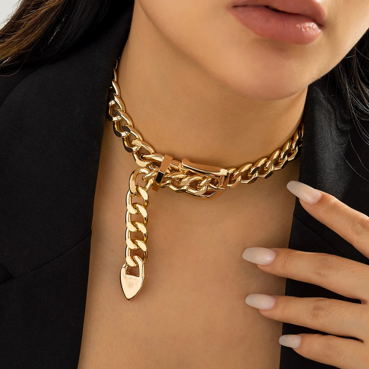 Gold chunky chain choker with heart-shaped charm on long link drop