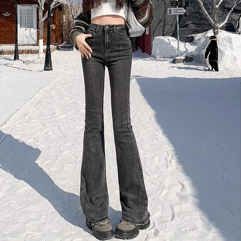 High-rise flare denim jeans, dark grey/black wash, curve-hugging waist and flared hem