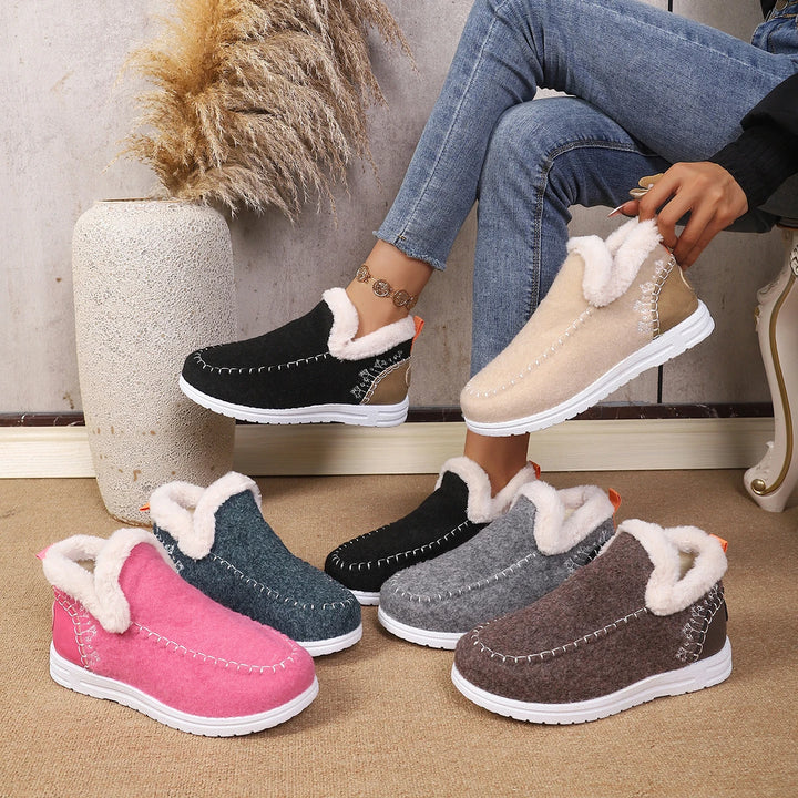 Women’s slip-on ankle snow loafer in pink, with fuzzy collar and white rubber sole