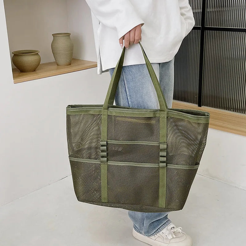 Olive green sheer mesh tote bag with open top and wide carry handles