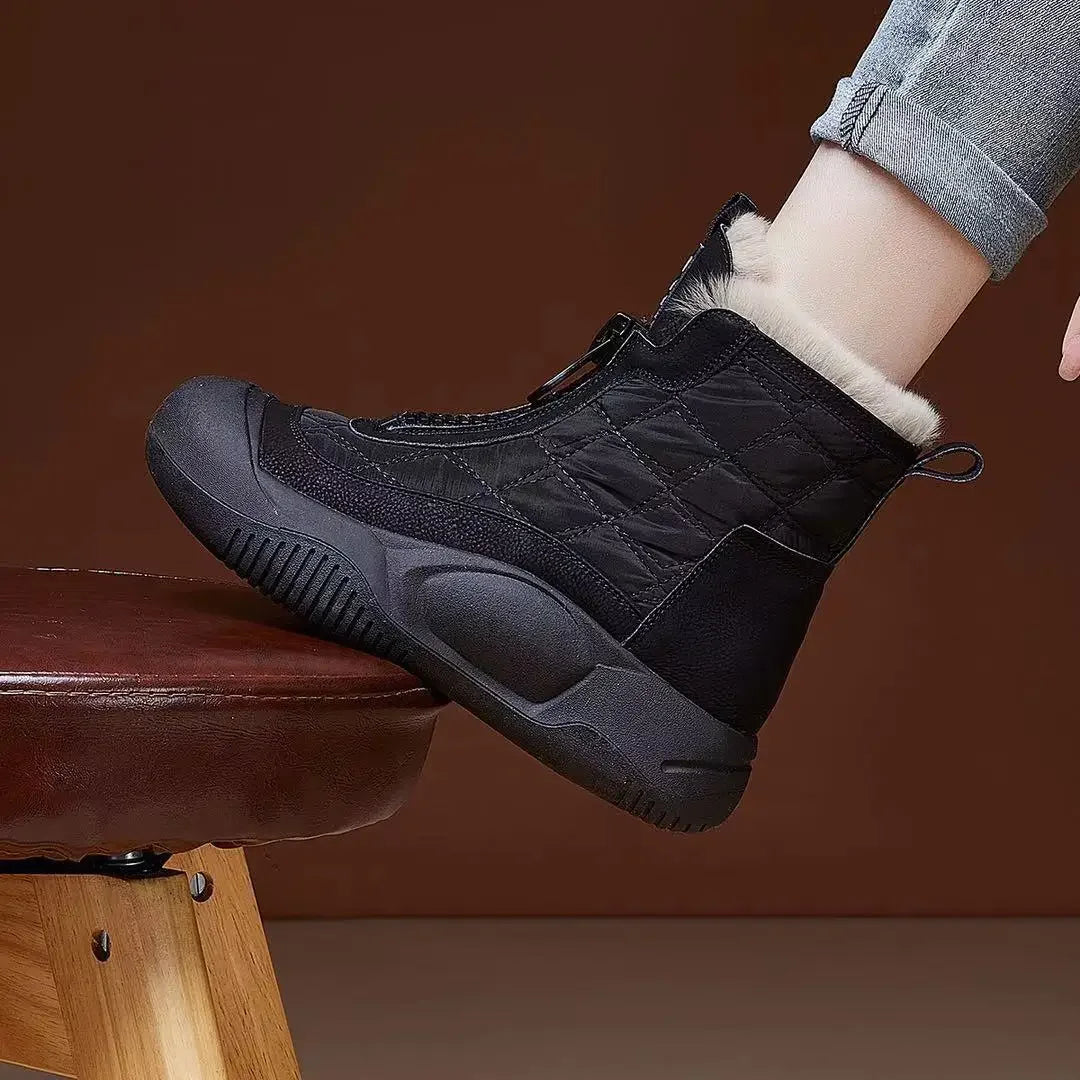 Black winter boot with fur lining on a brown background