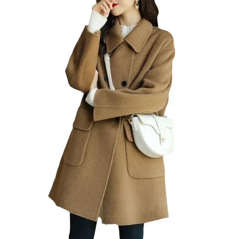 Brown coat worn by a person on a white background