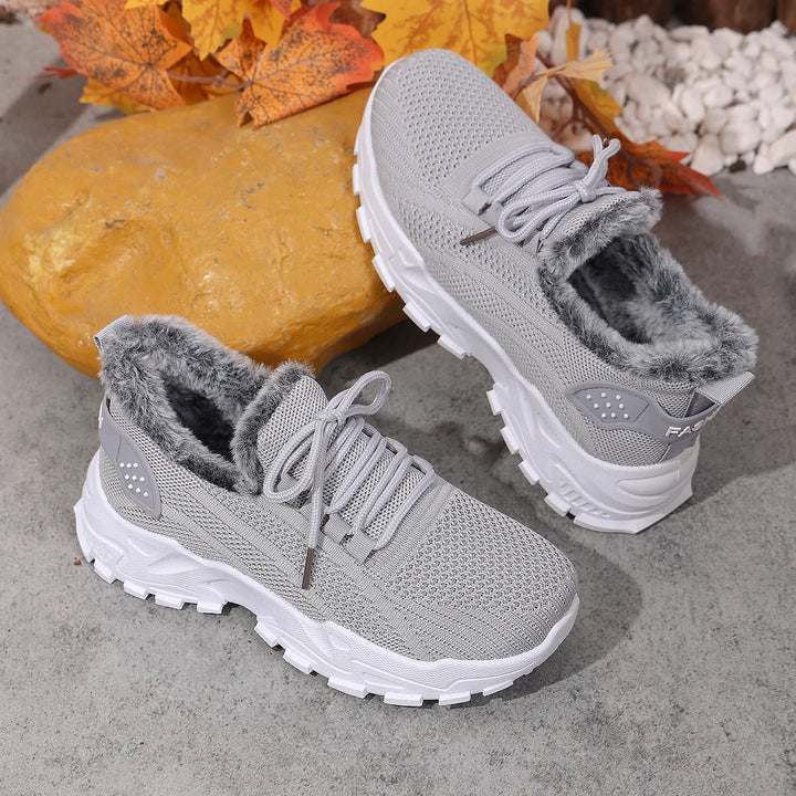 Women’s gray knit lace-up snow sneakers with plush gray lining and chunky tread sole