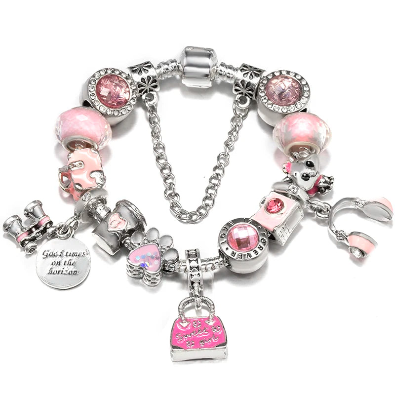Silver charm bracelet with pink beads and charms, including bear and gift bag pendant