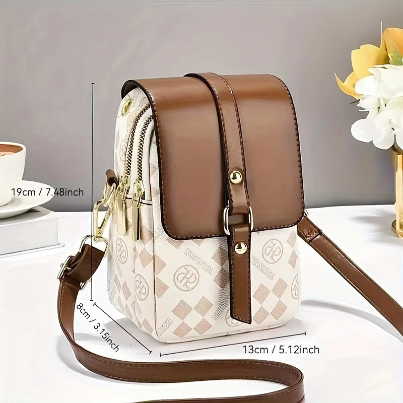 Brown and beige handbag with measurements on a light gray background