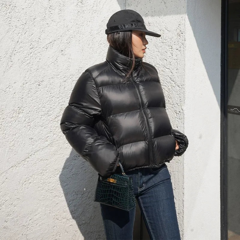 Women wearing black thick padded puffer coat.