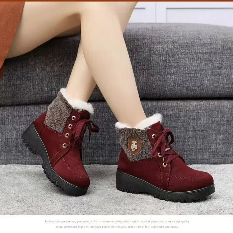 Women’s burgundy lace-up winter boots with faux-fur cuffs and grippy tread sole